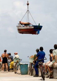 People prepare their boat against the coming of Hurricane Ike. Stay in the ship and wade out the economic crisis to enjoy the most safety.
