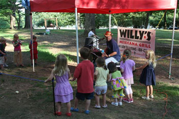 Jay Memory of The Memory Dean Band entertains his tiniest fans at the Chastain Chill event.