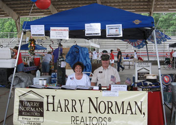 (On the left) Faye Meyer - Harry Norman, Realtors® on the Square in McDonough office Executive Assistant and Comptroller, and Mark Barr - Harry Norman, Realtors® Sales Associate who served in the Marine Corps.